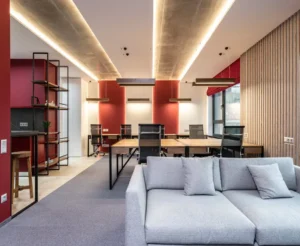 A room with a couch and tables in it