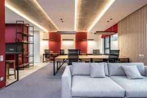 A room with many tables and chairs in it