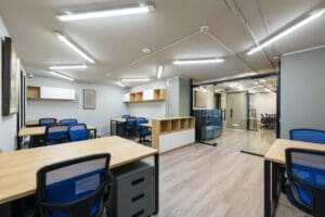 A room with many desks and chairs in it