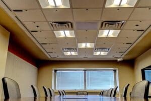 Photo of a conference room equipped with multiple Telelumen Octa LED light synthesizers in the ceiling. These programmable LED light synthesizers give this testbed the capability to vary light conditions to test intelligent lighting systems with embedded sensors.