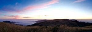 A view of the ocean from above, at sunset.